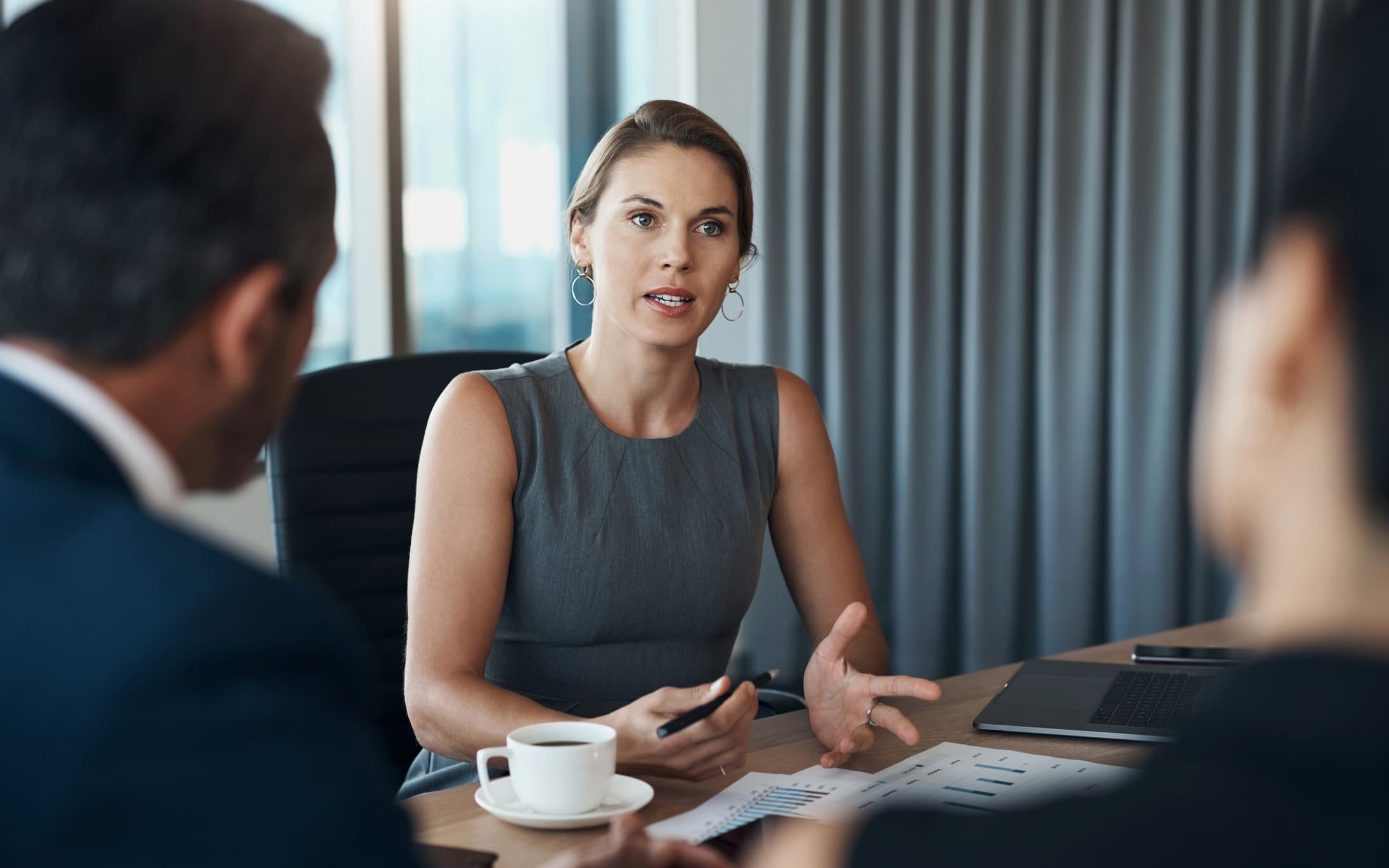 Lawyer at Desk with Clients